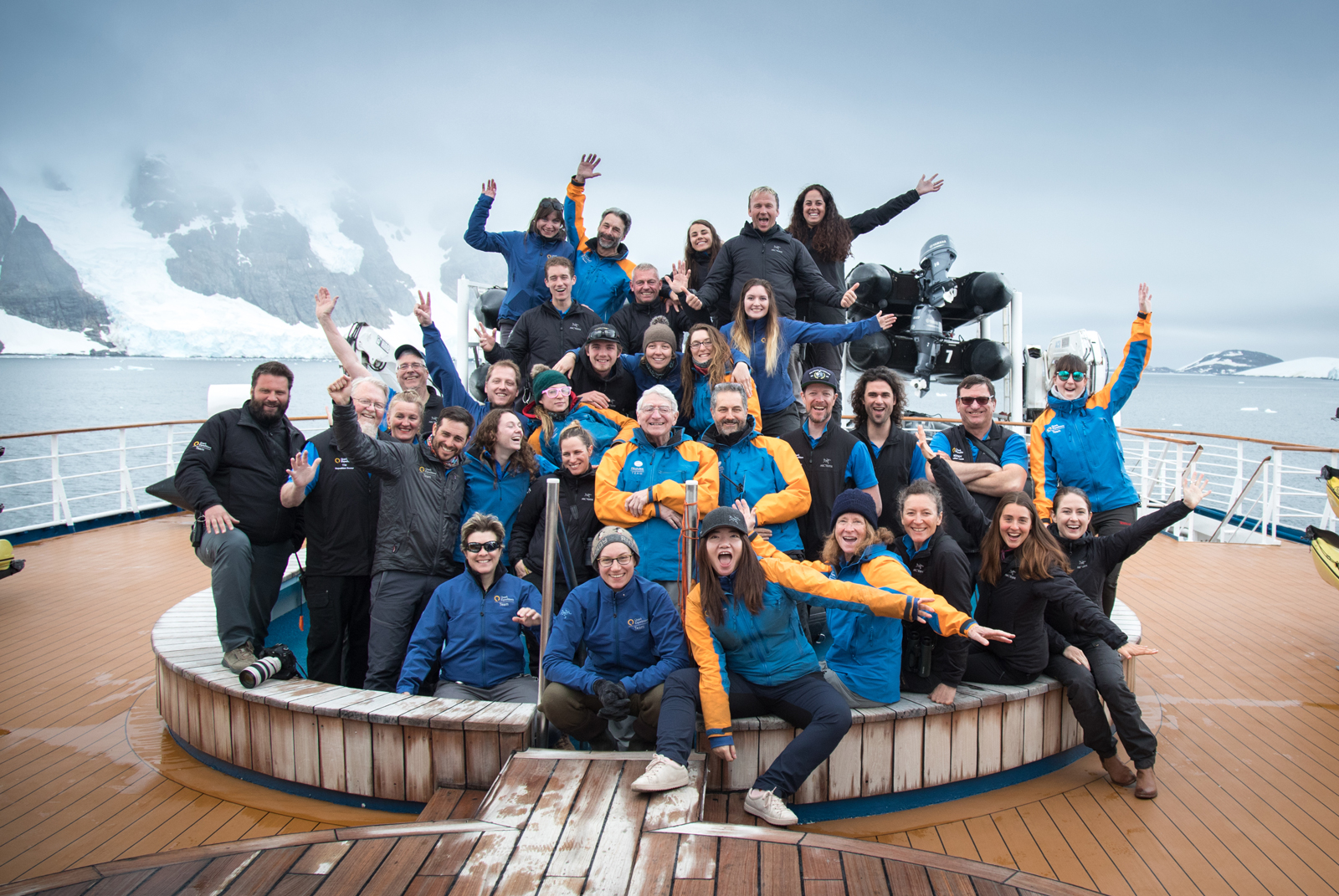 Expedition Team Members pose for a group photo on the Ocean Diamond