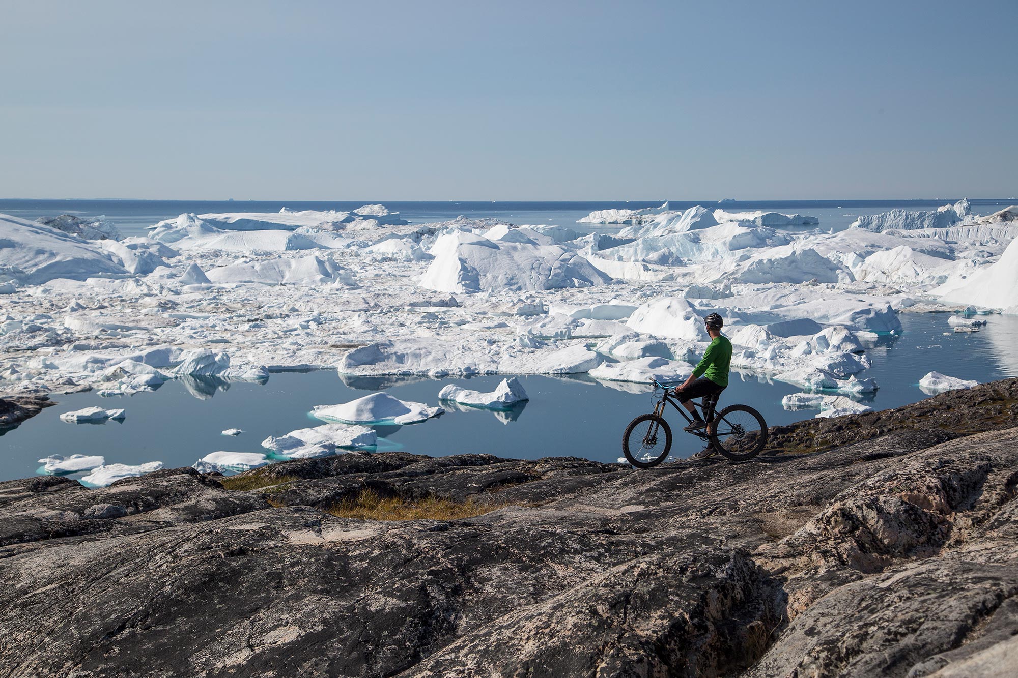 A traveler enjoys a relaxing mountain bike ride in South Greenland.