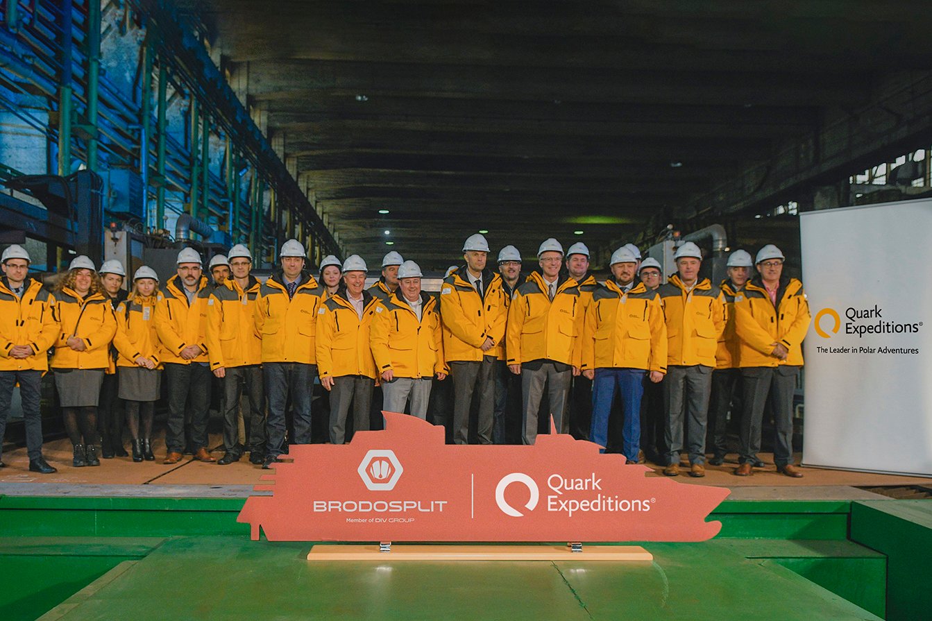 Quark Expeditions and Brodosplit team pose for a group photo at the Steel-Cutting Ceremony at the Shipyard. 