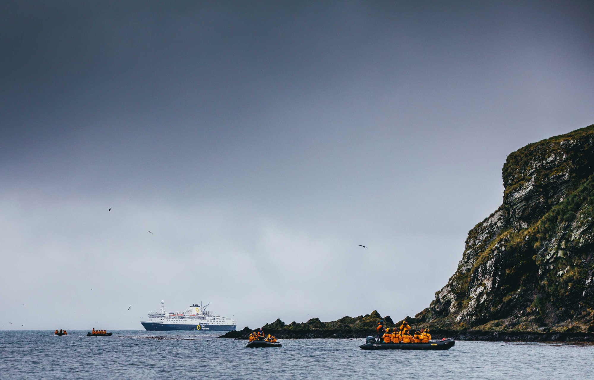 Zodiac cruising with the Ocean Endeavour in the background. Photo: David Merron